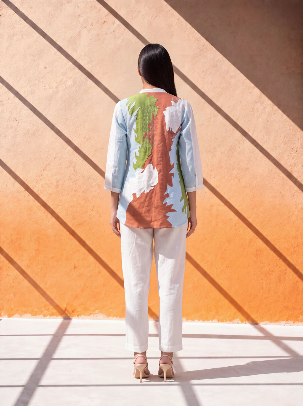 White linen coordinate set with floral embroidery and handworked back design
