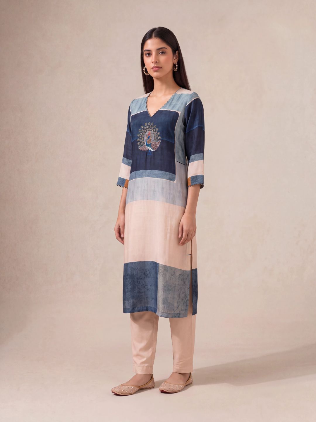 Offwhite semi-tussar salwar suit with peacock khat and kardana embroidery