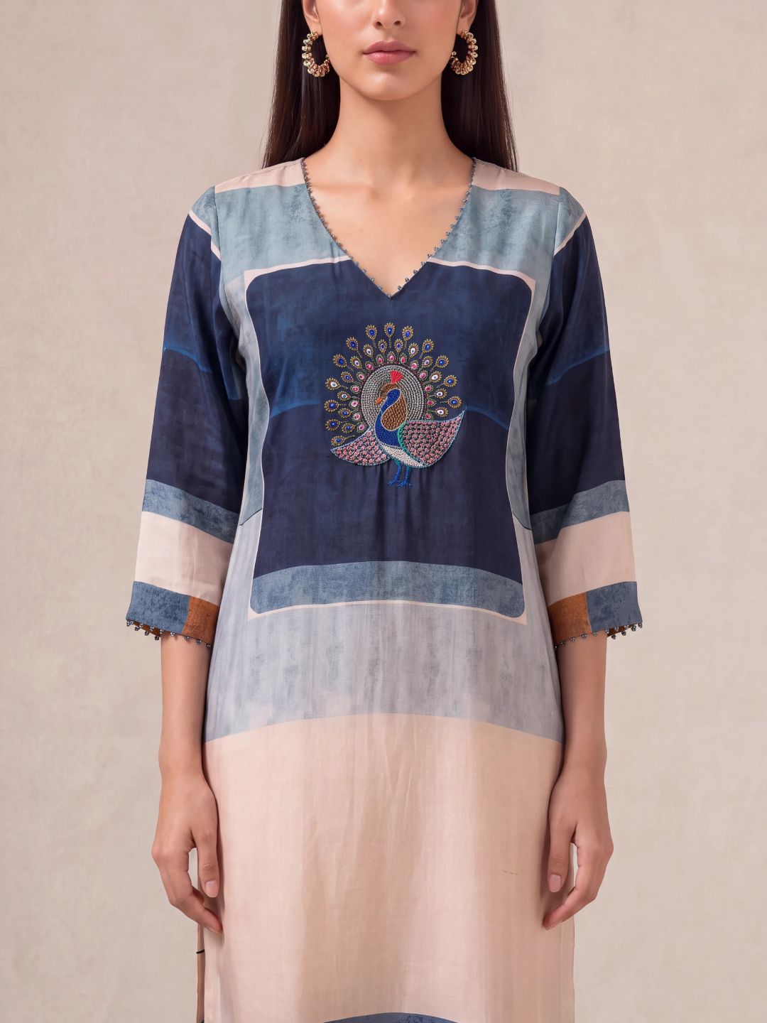 Offwhite semi-tussar salwar suit with peacock khat and kardana embroidery