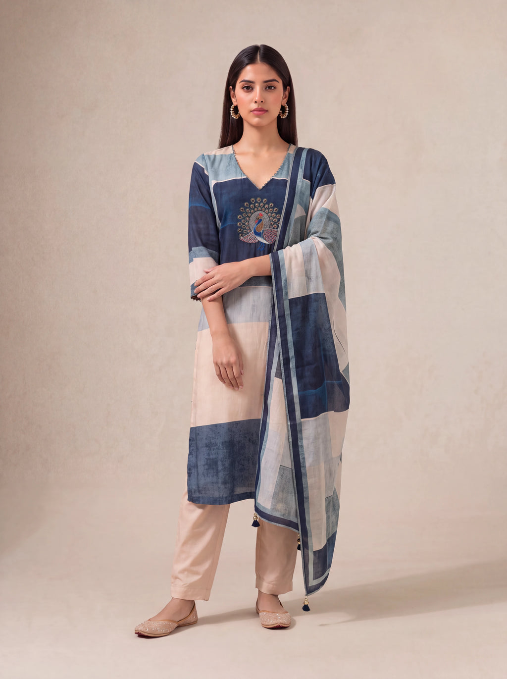 Offwhite semi-tussar salwar suit with peacock khat and kardana embroidery